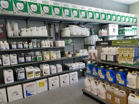 Lawn care supplier store with shelves of herbicides